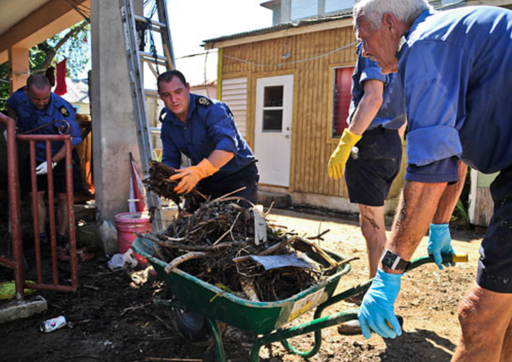 Crew of RFA Wave Ruler helping to clear flood debris, Tortola, British Virgin Islands Credit: Government of British Virgin Islands